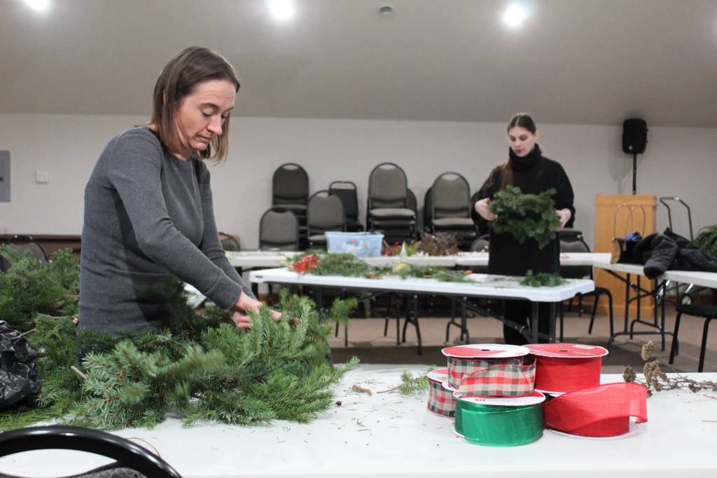Photos by Karina Andrew/Whidbey News-Times
Mosa Neis, left, and Dawn Meredith work on native plant wreaths at the Pacific Rim Institute Dec. 6.