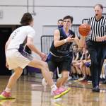 Photo by John Fisken
South Whidbey junior Cash Hajny dribbles around a rival from Oak Harbor High School. Although South Whidbey High School lost 58-26 to Oak Harbor High School, Hajny scored 2 points with 3 rebounds, 2 steals and an assist.