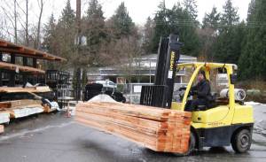 Yard attendant Brady Mullins drives a forklift to load 2x6 boards at Frontier Building Supply in Freeland.  With high demand and diminished supply, lumber costs nearly twice as much now as two months ago.