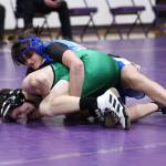 Photo by John Fisken
South Whidbey freshman Kaylie Baker pins an opponent from Oak Harbor on Jan. 5.