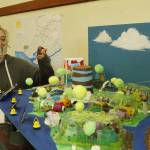 Photo by Kira Erickson/South Whidbey Record
Eighth grader Alicia Jenkins displays the model of Siyá:m, the fictional futuristic city middle school students designed.