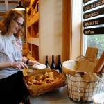 Photos by Kira Erickson/South Whidbey Record
Hannah McCabe, the manager of Seabiscuit Bakery, grabs a gougère to serve.