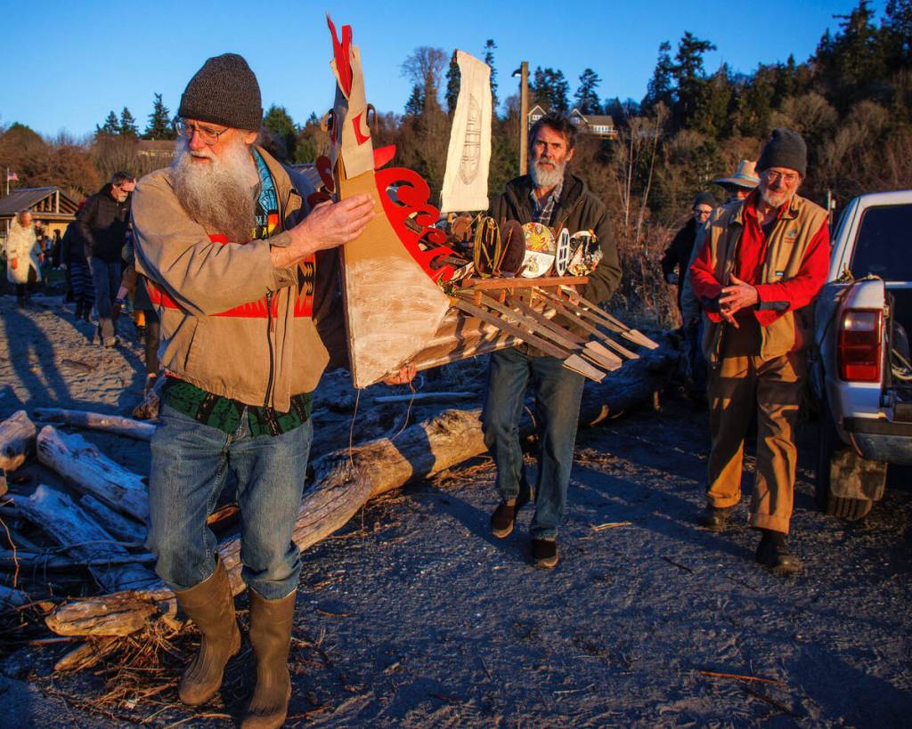 Photo by David Welton
Michael Clyburn, left, and Ryan Kerkvliet carried the Viking boat to the waters edge at Maxwelton Beach on Saturday.