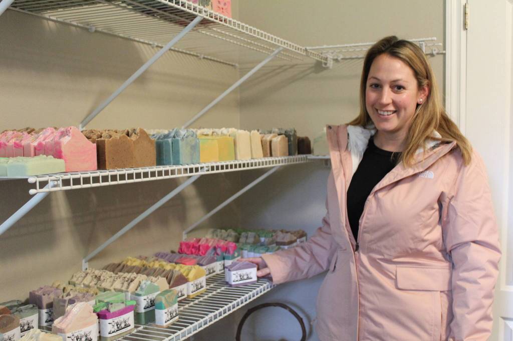 Sheena Bodenhafer shows off some of her products. Her homemade goat milk soaps come in a variety of scents, including some locally-inspired aromas such as Local Brew, Whidbey Island and Pacific Coast Trail. (Photo by Karina Andrew/Whidbey News-Times)