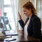 State Representative of the 38th Legislative District Emily Wicks raises hand during her virtual swearing in from her Everett home in January 2021. (Olivia Vanni / Herald file)