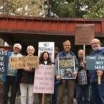 Photo provided
Members of the Not in Our Parks Coalition hold signs protesting Navy training in state parks.