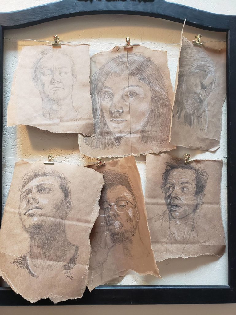 Photo provided
Paper bag portraits by Karin Bolstad are also on display.