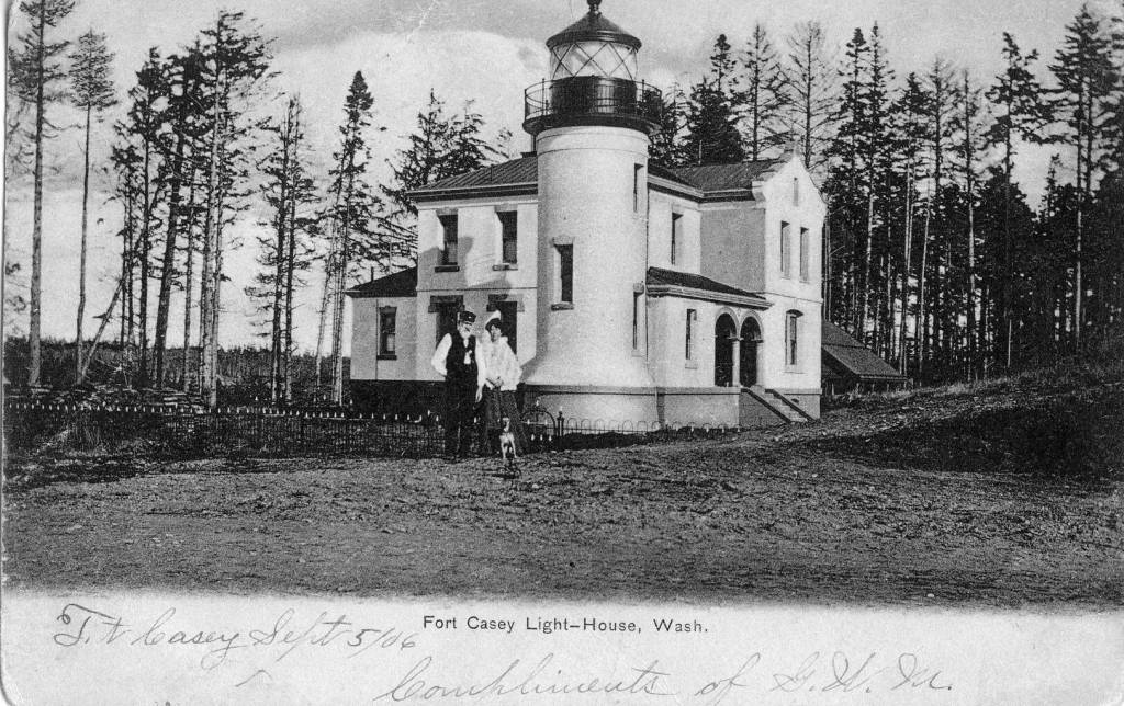 Admiralty Head Lighthouse
Black and White postcard photo of 1906 lighthouse keeper Charles and Delia Davis with dog. Bottom of postcard reads: Ft. Casey Sept 5th 1906, Compliments of G.W.M. Back of postcard reads: Miss Anna Lasser 
            San De Fuca, Wash
 
photo postcard of Admiralty Head Lighthouse keepers Charles and Delia Davis