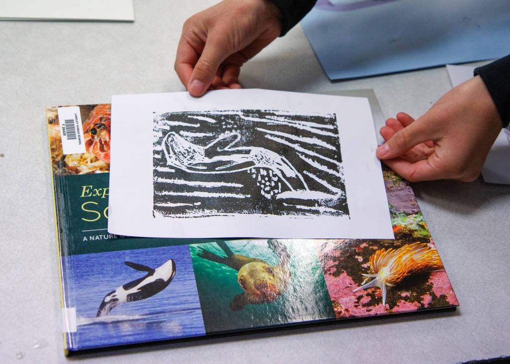 Photo by David Welton
Fourth graders have spent recent art classes creating block prints, which require painting over a stencil and pressing it to a clean sheet of paper to produce an image of marine life.