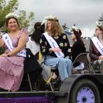 Miss Oak Harbor Thinalyn Ramier and her court ride by on a float. (Photo by Karina Andrew/Whidbey News-Times)
