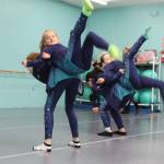 Kenley Burdick, top left, and Zaelie Blackburn, top right, rehearse with their teammates for an upcoming dance competition. (Photo by Karina Andrew/Whidbey News-Times)