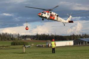 Navy Search and Rescue lands a Sikorsky MH-60S Nighthawk during Mondays training. Naval Air Station Whidbey Island Search and Rescue has two MH-60S helicopters and can conduct both overwater and mountain rescue including helicopter rappel, hoist and mountain landing. (Photo by Karina Andrew/Whidbey News-Times)