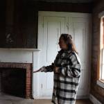 Reserve education and outreach coordinator Jordan Belcher shows the former dining room of the Jacob and Sarah Ebey House. (Photo by Karina Andrew/Whidbey News-Times)