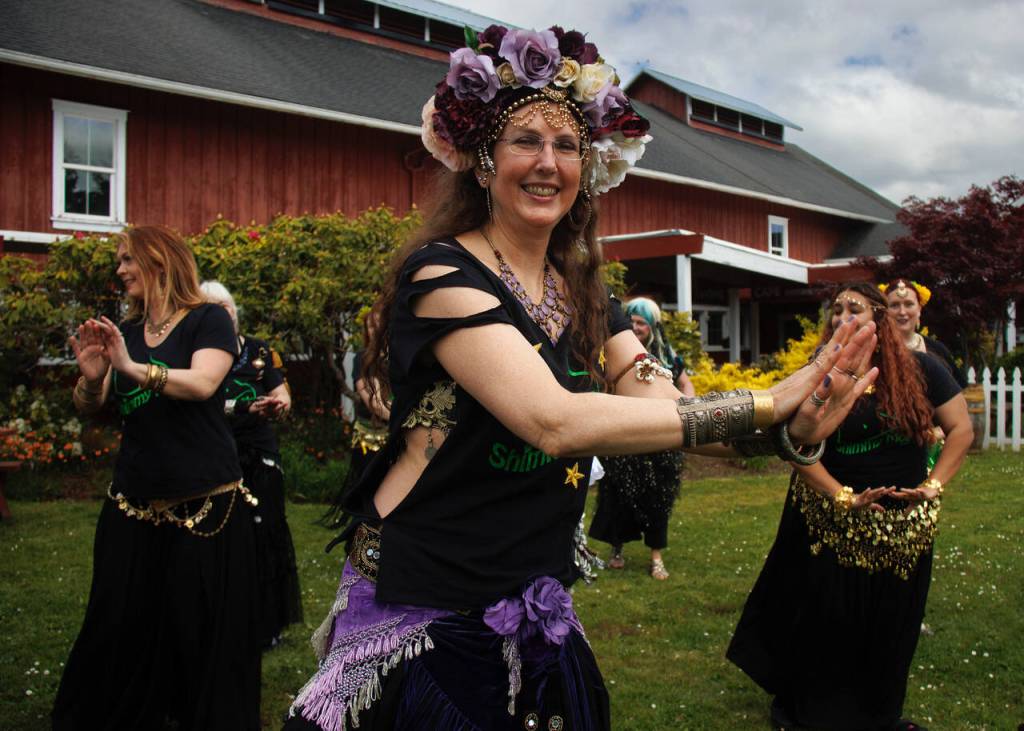 Aristana Firethorne, center, belly dances at the Greenbank Farm. (Photo by David Welton)