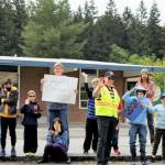 Children and faculty members standing outside of South Whidbey Elementary School cheered as the parade of high school seniors passed by them. (Photo by Kira Erickson/South Whidbey Record)