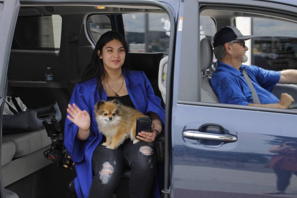 Makea Mendoza waves at well-wishers in downtown Langley during the parade for the Class of 2022. (Photo by Kira Erickson/South Whidbey Record)