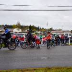 Broad View Elementary School students and staff ride alongside Oak Harbor police officers in a bike parade in honor of Bike to School day last month. (Oak Harbor School District photo)