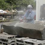 Photo by Kira Erickson/South Whidbey Record
Sue Taves carves an enormous chunk of basalt.