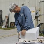 Photo by Kira Erickson/South Whidbey Record
Sue Taves sands a block of marble.