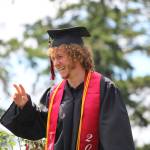 Photo by Karina Andrew/Whidbey News-Times
Graduate Caleb Meyer grins on his way off the stage after receiving his diploma.