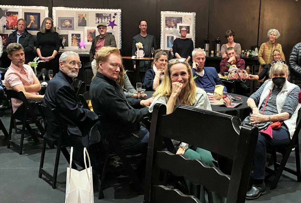 Photo by Billy Tierney
Playwright Liza Powel OBrien, center, sits beside her celebrity husband Conan at an opening night party for Apostrophe.