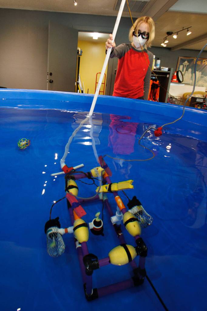 Solomon Hilliard, 13, flies a remotely operated vehicle made by Etta Cameron, 12 and Maisie Pendell, 12. (Photo by David Welton)
