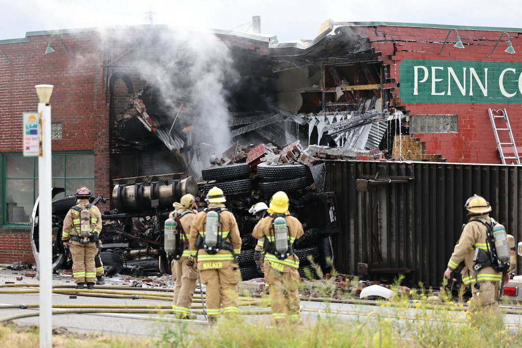Photo by John Fisken
Several Whidbey and state agencies responded when a semi truck took out a corner of the historic Hingston Store, now Penn Cove Pottery.