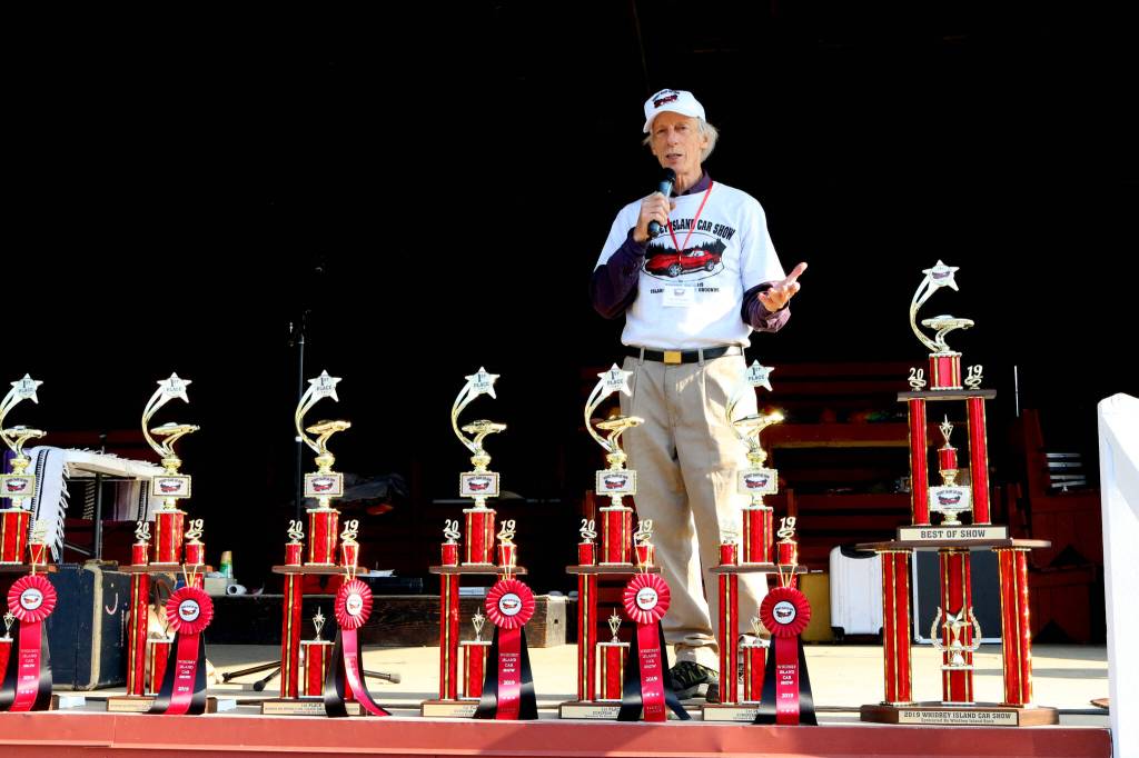 Jim Freeman, pictured here in 2019 at the Whidbey Island Car Show, was known as the Conductor of Fun. (Photo by Bruce Bell)