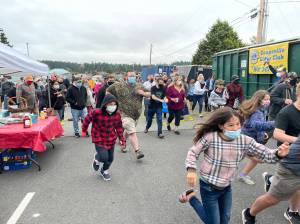 Last year, shoppers rush to find treasures at the islands largest garage sale. (Photo provided.)