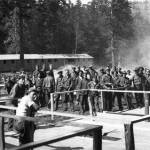 Civilian Conservation Corps members gather near buildings under construction. (Washington State Archives photo)