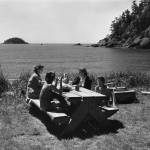 Washington State Advertising Commission
A family has a picnic in Deception Pass State Park, circa 1960.