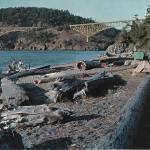 Deception Pass State Park visitors enjoy a view of the bridge from north beach in 1962.