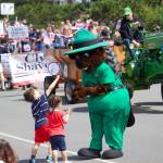 A Deception Pass State Park ranger hands out candy to children in the Oak Harbor Fourth of July parade.