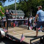 Bob Bowling returns a serve on the traveling pickleball court that was part of the Maxwelton parade.