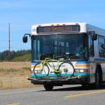 An Island Transit bus drives in a rural area. (Photo provided by Island County Transit)