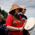 Becky Porter joins Langley Mayor Scott Chaplin in welcoming the Blue Heron Canoe Family as they arrive in Langley. (Photo by David Welton)
