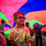 A child plays under a parachute during Family Story Time at Castle Park in Langley July 6. (Photo by David Welton)
A youngster plays under a parachute at Family Story Time at Castle Park in Langley July 6. (Photo by David Welton)