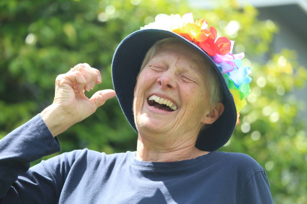 Janice Gibson chuckles while participating in an improvisation vignette during laughter yoga.