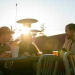 Ethan, Jessica and Reade McCardell sip on some beers at the Backlot Tavern at the Blue Fox Drive-In Theater. The tavern was added in 2020. (Ryan Berry / The Herald)