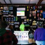 People line up to get their prizes at the arcade at the Blue Fox Drive-In Theater. (Ryan Berry / The Herald)