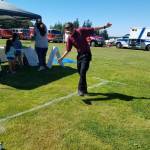 A participant wearing fatal vision goggles attempts to walk in a straight line at last years National Night Out. (Photo provided by Oak Harbor Police Department)