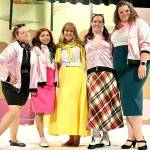 From left, Grease cast members Sara Hampton, Marianne Campos, Karina Andrew, Jordon Spanovich and Erin Tombaugh rehearse at the Whidbey Playhouse. (Photo provided)