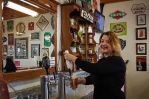 Photo by David Welton
Francesca Coenen-Winer pours a beer at the Taproom at Bayview Corner. The current general manager, Coenen-Winer will be taking over ownership of the business starting in September.