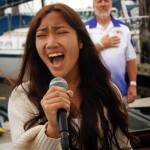 Danika Kloeker sings the national anthem to kick off the event. (Photo by David Welton)