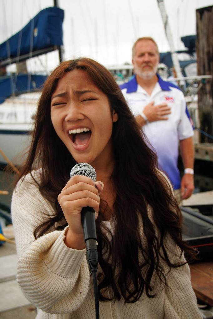 Danika Kloeker sings the national anthem to kick off the event. (Photo by David Welton)