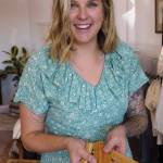 Kelly Sorensen Hansen shows off a kids wooden play tool set.