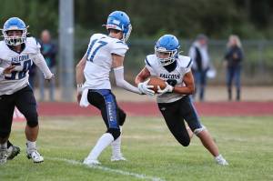 Photo by John Fisken
The South Whidbey Falcons are off to a flying start this football season with an undefeated 2-0 record so far. During Friday nights game against Coupeville, Josh Sterba, middle, hands off the ball to running back Cody Redford, right, while Cash Hajny, left, gets set to make a block. South Whidbey won a hard-fought contest of 44-28 against the Wolves.
This Friday, Sept. 16, the Falcons go on the road again, taking on the East Jefferson Rivals  a combination of Port Townsend and Chimacum high schools  in Port Townsend at 6:30 p.m.