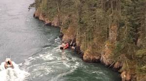 Image provided
A screenshot from a North Whidbey Fire and Rescue video shows Marine Search and Rescue vessels assisting two kayakers who were swept out of Cornet Bay by the strong currents under Deception Pass bridge Sept. 11.