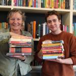 Photo by Karina Andrew/Whidbey News-Times
Meg Olson and Felix Hall show off some of the classic and contemporary titles found at Kingfisher Bookstore that have faced challenges or ban attempts at various points throughout history.