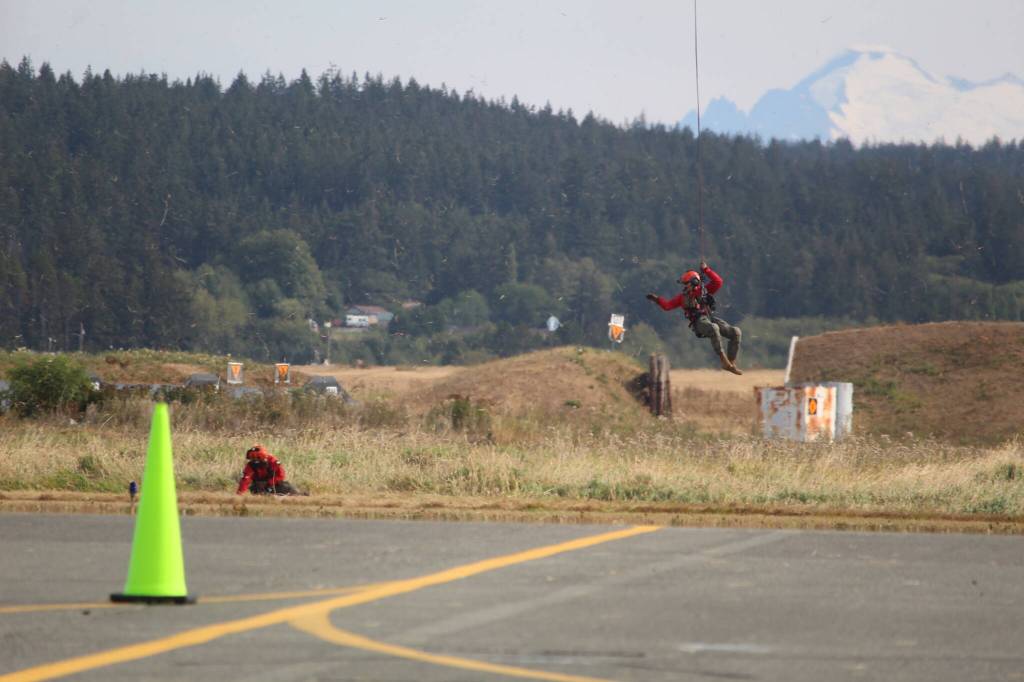 Photo by Karina Andrew/Whidbey News-Times
Navy Search and Rescue performs a demonstration during the open house at Naval Air Station Whidbey Island Sept. 17.